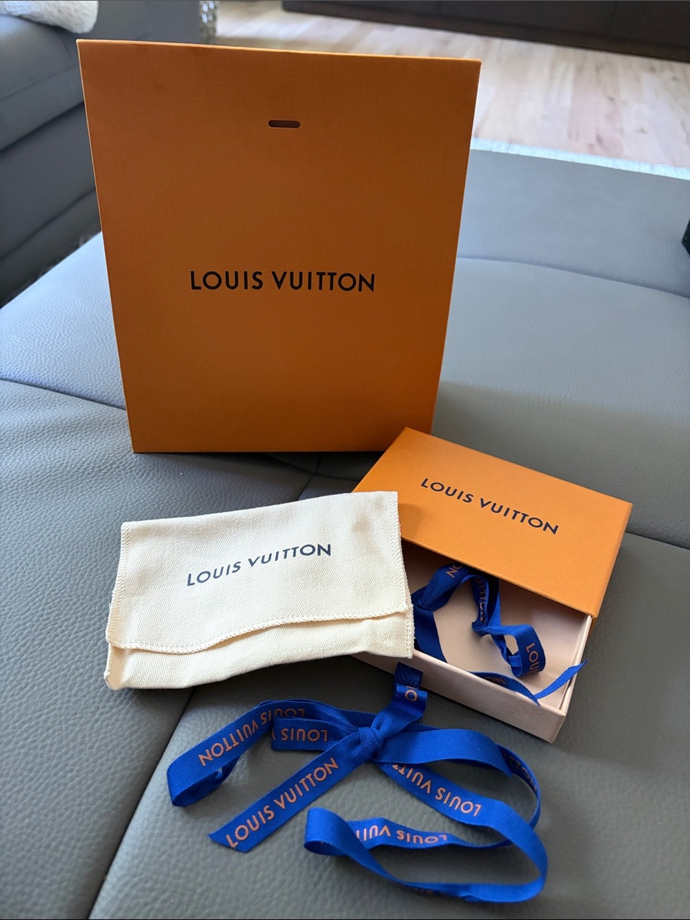 Louis Vuitton Orange Gift Set with Blue Ribbon and Cream Pouch